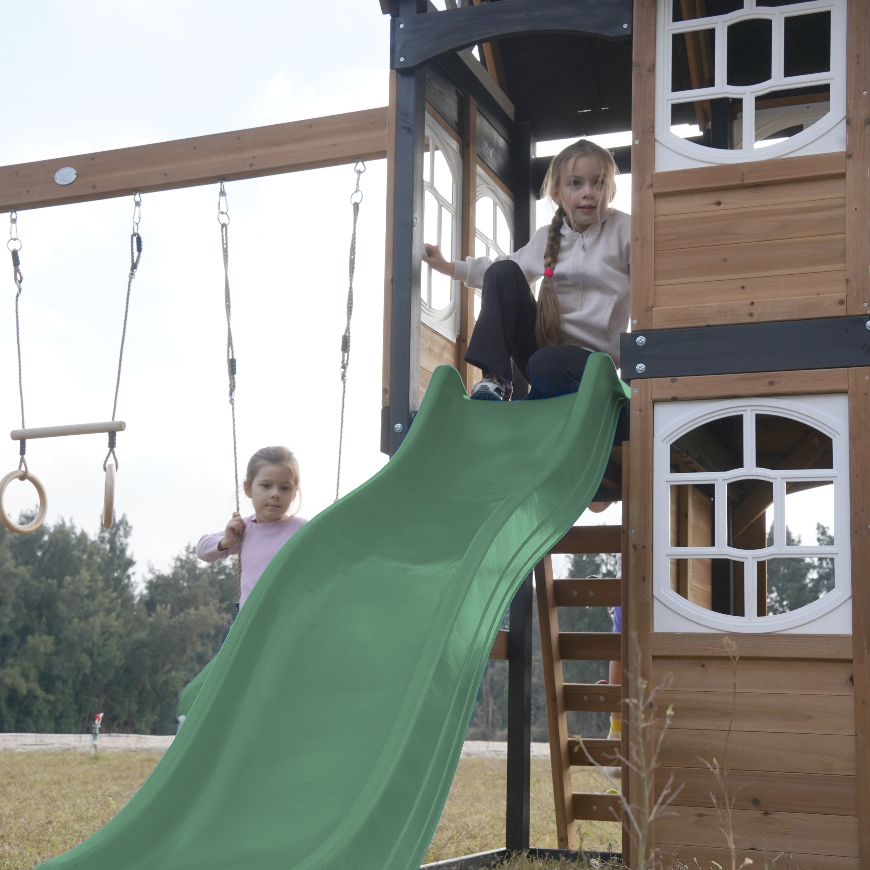 AXI Noud Climbing Frame with Playhouse, Swings, Trapeze and Climbing Wall – Green Slide and Tube Slide