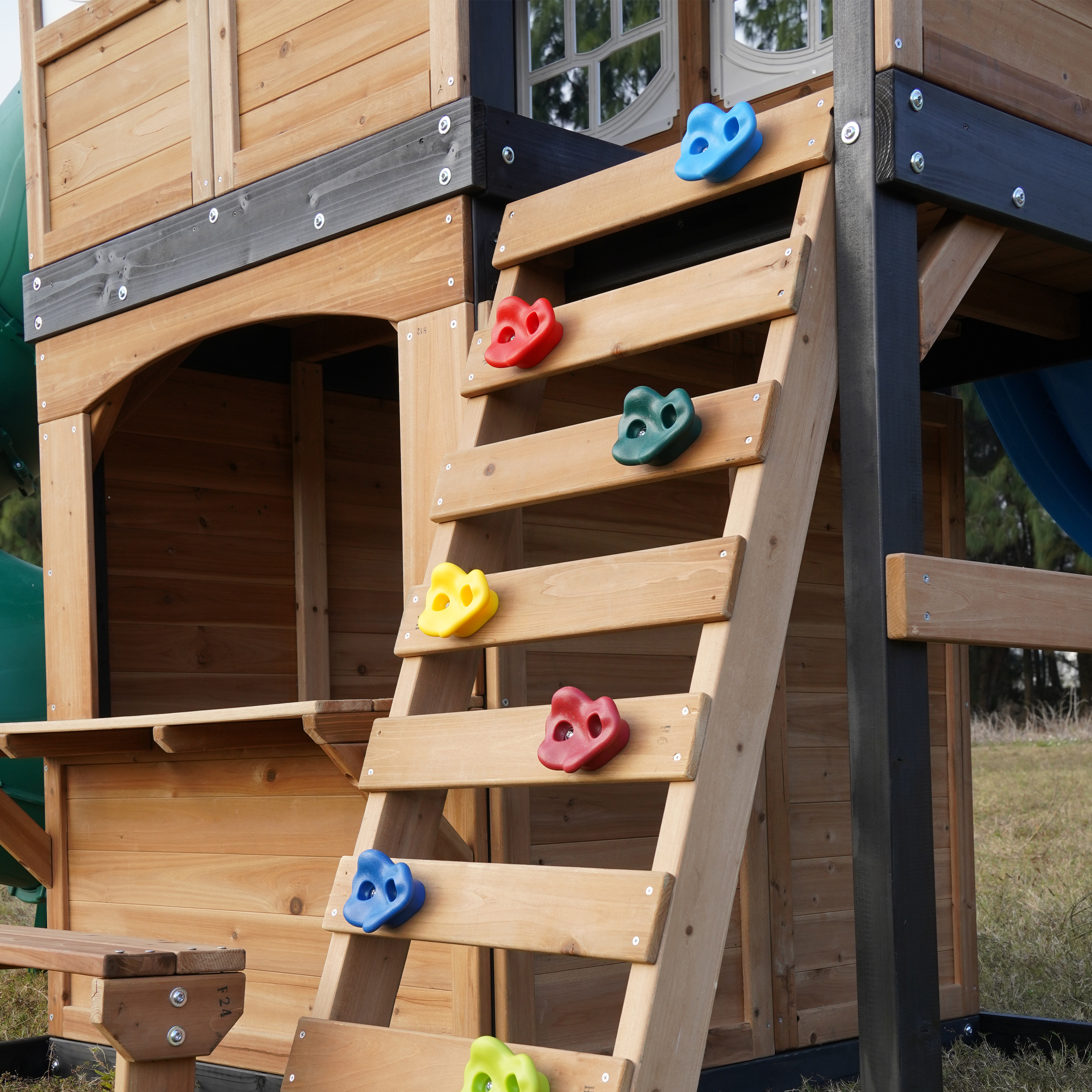 AXI Noud Climbing Frame with Playhouse, Swings, Trapeze and Climbing Wall – Green Slide and Tube Slide