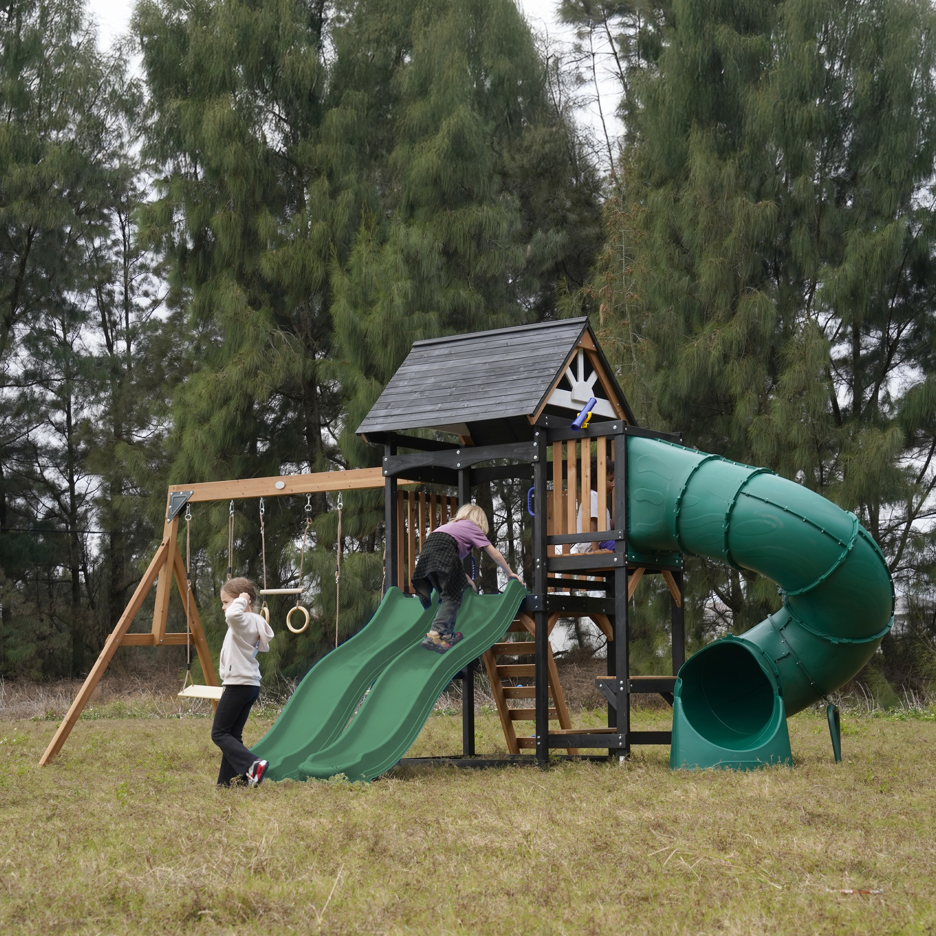 AXI Cody Climbing Frame with Swings, Trapeze and Climbing Wall – Green Double Slide and Tube Slide