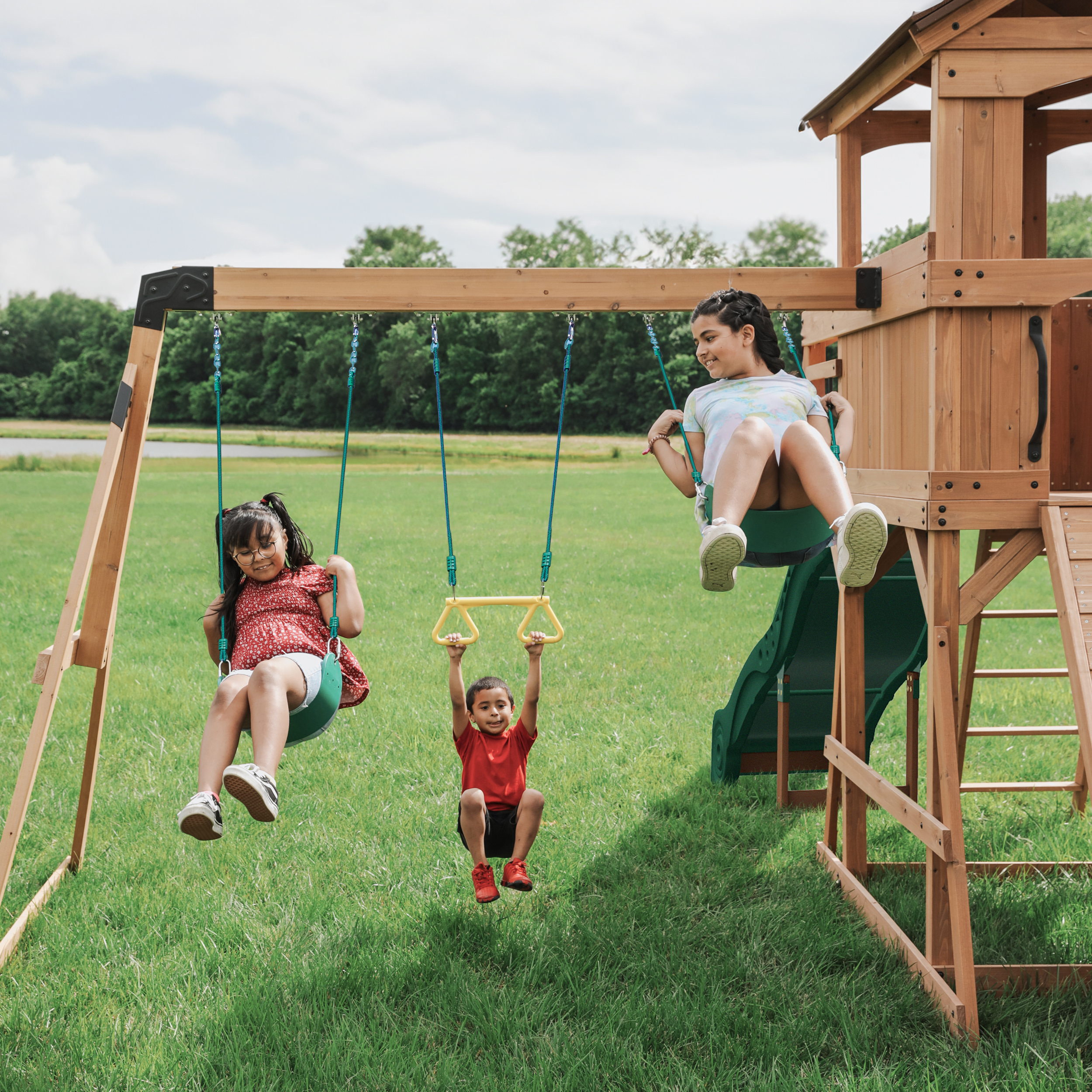 Backyard Discovery Sterling Point Play Set with 3 Swings and Slide - Climbing Wall & Rock Wall - Trapeze - Sandbox - Walkway