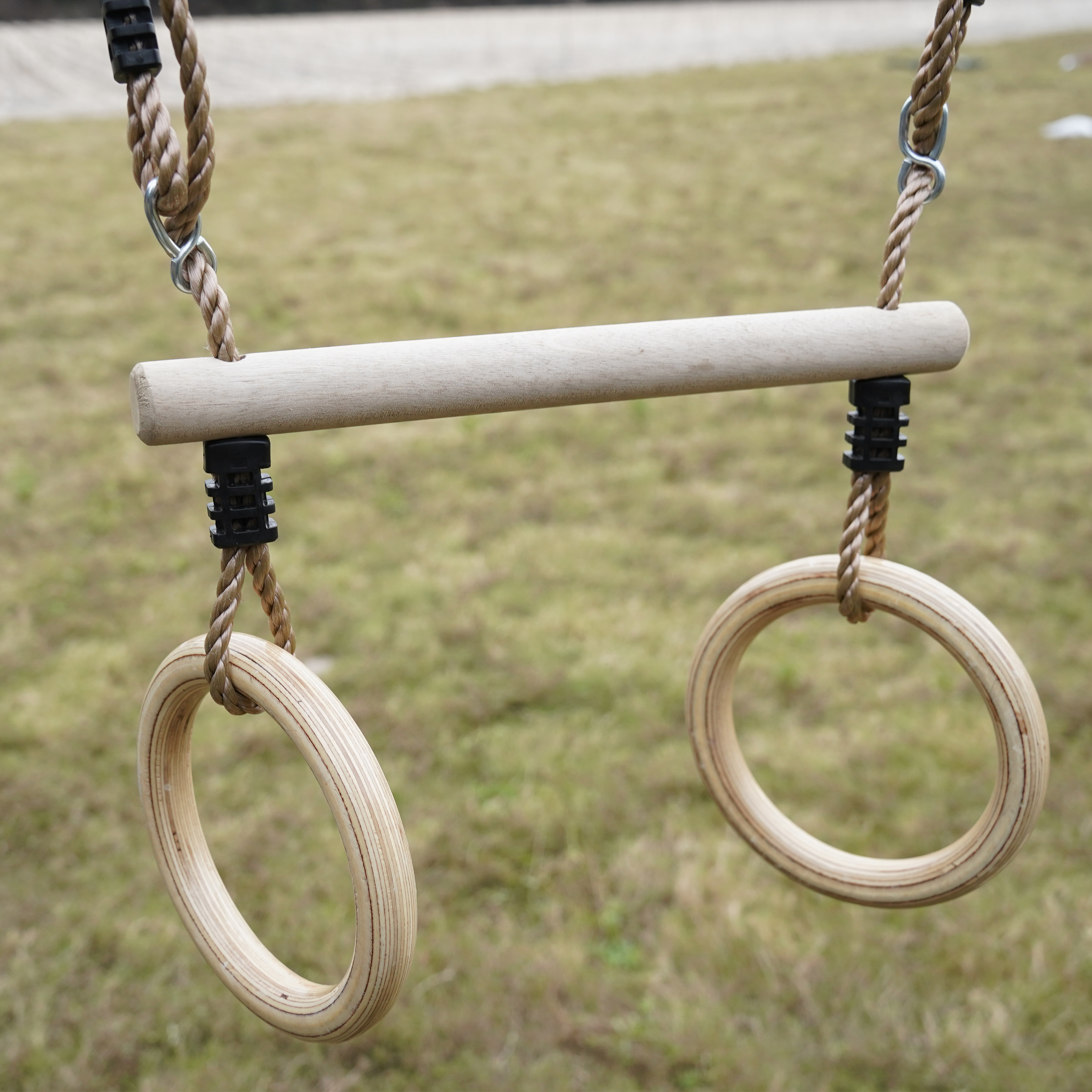 AXI Noud Climbing Frame with Playhouse, Swings, Trapeze and Climbing Wall – Green Slide and Tube Slide